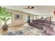 Spacious living room with a large sectional sofa and ample natural light at 12738 Hysmith Loop, Parrish, FL 34219
