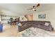 Open floor plan with living room, dining area, and kitchen, featuring a sectional sofa at 12738 Hysmith Loop, Parrish, FL 34219