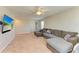 Upstairs living area featuring a sectional sofa and TV at 12738 Hysmith Loop, Parrish, FL 34219
