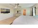Bright main bedroom featuring a wall mounted TV, and neutral tones at 12738 Hysmith Loop, Parrish, FL 34219