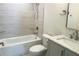 Bathroom features tub/shower combo, tiled walls and modern vanity at 1428 19Th St, Sarasota, FL 34234