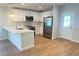 Bright kitchen with a breakfast bar, stainless steel appliances, and modern cabinetry at 1428 19Th St, Sarasota, FL 34234