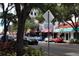 Street view with cars parked along shops, featuring restaurants and consignment store at 1428 19Th St, Sarasota, FL 34234