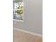 A bedroom view that shows a window for natural light and wood floors at 1596 Laurel Brook Ln, Port Charlotte, FL 33953