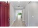 Bright entryway features tile flooring, crown molding, and a clear view of the living room beyond at 1596 Laurel Brook Ln, Port Charlotte, FL 33953