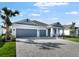 Beautiful home with a spacious three car garage and a brick paved driveway at 1596 Laurel Brook Ln, Port Charlotte, FL 33953