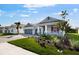 Charming single-story home featuring a well-manicured lawn and welcoming front porch at 1596 Laurel Brook Ln, Port Charlotte, FL 33953