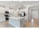 Open concept kitchen features a center island, stainless steel appliances, and access to the backyard at 1596 Laurel Brook Ln, Port Charlotte, FL 33953