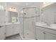 Bathroom featuring glass enclosed shower with dual vanities at 16226 Paynes Mill Dr, Bradenton, FL 34211