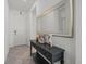 Inviting entryway with decorative table and mirror, offering a warm welcome to the home at 16226 Paynes Mill Dr, Bradenton, FL 34211