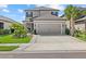 Charming home with a two-car garage, well-kept lawn, and landscaped surroundings at 16226 Paynes Mill Dr, Bradenton, FL 34211