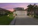 Charming two-story home with well-manicured lawn, fresh landscaping, and a two car garage at 16226 Paynes Mill Dr, Bradenton, FL 34211