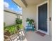 Charming front porch with seating and decor welcomes you to this lovely home at 16226 Paynes Mill Dr, Bradenton, FL 34211