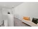 Upstairs hallway featuring a comfortable bench with decorative pillows and neutral walls at 16226 Paynes Mill Dr, Bradenton, FL 34211