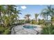 Community hot tub area with surrounding landscaping and lounge chairs at 16226 Paynes Mill Dr, Bradenton, FL 34211
