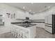 Modern kitchen with granite countertops, stainless steel appliances, and white cabinets at 16226 Paynes Mill Dr, Bradenton, FL 34211