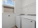 Convenient laundry room with modern washer and dryer units at 16226 Paynes Mill Dr, Bradenton, FL 34211