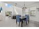 Open living room and dining room area with a high ceiling provides ample natural light at 16226 Paynes Mill Dr, Bradenton, FL 34211