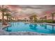 Resort-style pool featuring shallow entry, palm trees and lounge chairs at 16226 Paynes Mill Dr, Bradenton, FL 34211
