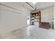 Functional garage space with shelving, stairs and an access door to the exterior at 1918 Dixie Ave Ave, Punta Gorda, FL 33950