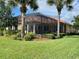 Screened in lanai in a backyard with mature landscaping and a manicured lawn at 193 Montelluna Dr, North Venice, FL 34275