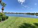 Water view in the backyard on a sunny day, with the neighborhood in the distance at 193 Montelluna Dr, North Venice, FL 34275