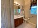 Bathroom featuring a single vanity, glass enclosed shower, and tile flooring at 193 Montelluna Dr, North Venice, FL 34275