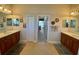 Bathroom featuring double sinks with a connecting door to the bedroom at 193 Montelluna Dr, North Venice, FL 34275