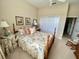 Bedroom featuring neutral walls, floral bedding, and a ceiling fan at 193 Montelluna Dr, North Venice, FL 34275