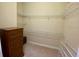 Walk-in closet with shelving for storage and organization, plus a dresser at 193 Montelluna Dr, North Venice, FL 34275