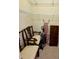 Walk-in closet with shelving, chairs and a vacuum cleaner at 193 Montelluna Dr, North Venice, FL 34275
