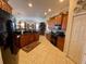 Modern kitchen featuring granite countertops, custom cabinets, and an open view of the living spaces at 193 Montelluna Dr, North Venice, FL 34275