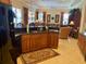 Modern kitchen featuring granite countertops, custom cabinets, and an open view of the living spaces at 193 Montelluna Dr, North Venice, FL 34275
