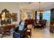 Open living and dining area with elegant furnishings, tile flooring, and natural light at 193 Montelluna Dr, North Venice, FL 34275