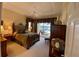 Main bedroom suite with luxurious decor and natural light and a door leading to the pool area at 193 Montelluna Dr, North Venice, FL 34275