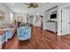 Spacious living room with comfortable seating, hardwood floors, and an open floor plan at 2064 Batello Dr, Venice, FL 34292