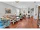 Spacious living room with hardwood floors, stylish furniture, and natural light at 2064 Batello Dr, Venice, FL 34292