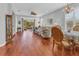 Spacious living room boasts hardwood floors and seamless access to a screened lanai at 2064 Batello Dr, Venice, FL 34292