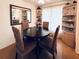 Cozy dining room features a round table and seating for four with a decorative corner cabinet at 217 Water Oak Ln, Sarasota, FL 34237