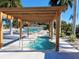 A community hot tub that features a wooden covering and landscaped surroundings at 217 Water Oak Ln, Sarasota, FL 34237