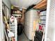 Organized storage area with shelving units and a large plastic storage container, maximizing space at 217 Water Oak Ln, Sarasota, FL 34237
