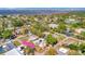 A view of the home surrounded by lush greenery and a glimpse of the water at 229 42Nd W St, Bradenton, FL 34209