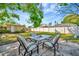 Outdoor seating area on concrete, set in a lush green yard at 229 42Nd W St, Bradenton, FL 34209