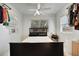 Bedroom with large windows, fan, and stylish decor create a relaxing atmosphere at 229 42Nd W St, Bradenton, FL 34209