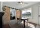 Dining room with fireplace and view to bedroom through the sliding barn doors, showcasing architectural details at 229 42Nd W St, Bradenton, FL 34209