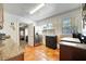 Bright kitchen with terracotta tile floors, stainless steel refrigerator, and granite countertops at 229 42Nd W St, Bradenton, FL 34209