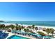 Panoramic aerial view highlighting the pristine beach, turquoise waters, and inviting pool area at 230 Sands Point Rd # 3501, Longboat Key, FL 34228