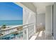 Balcony with ocean view, outdoor seating area and overhead view of the beach below at 230 Sands Point Rd # 3501, Longboat Key, FL 34228