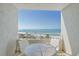 Balcony view of ocean and beach with seating, offering a relaxing outdoor space with beautiful coastal scenery at 230 Sands Point Rd # 3501, Longboat Key, FL 34228