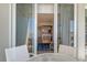 Balcony with ocean view through sliding glass doors to the kitchen and living area at 230 Sands Point Rd # 3501, Longboat Key, FL 34228
